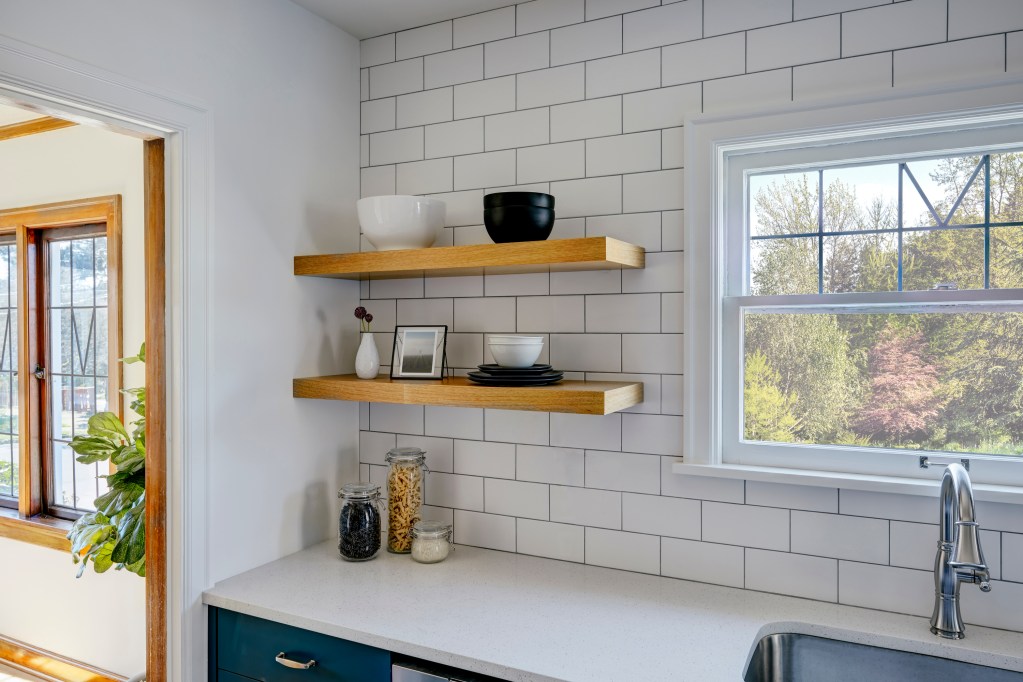 Kitchen floating shelves with matte tile backsplash