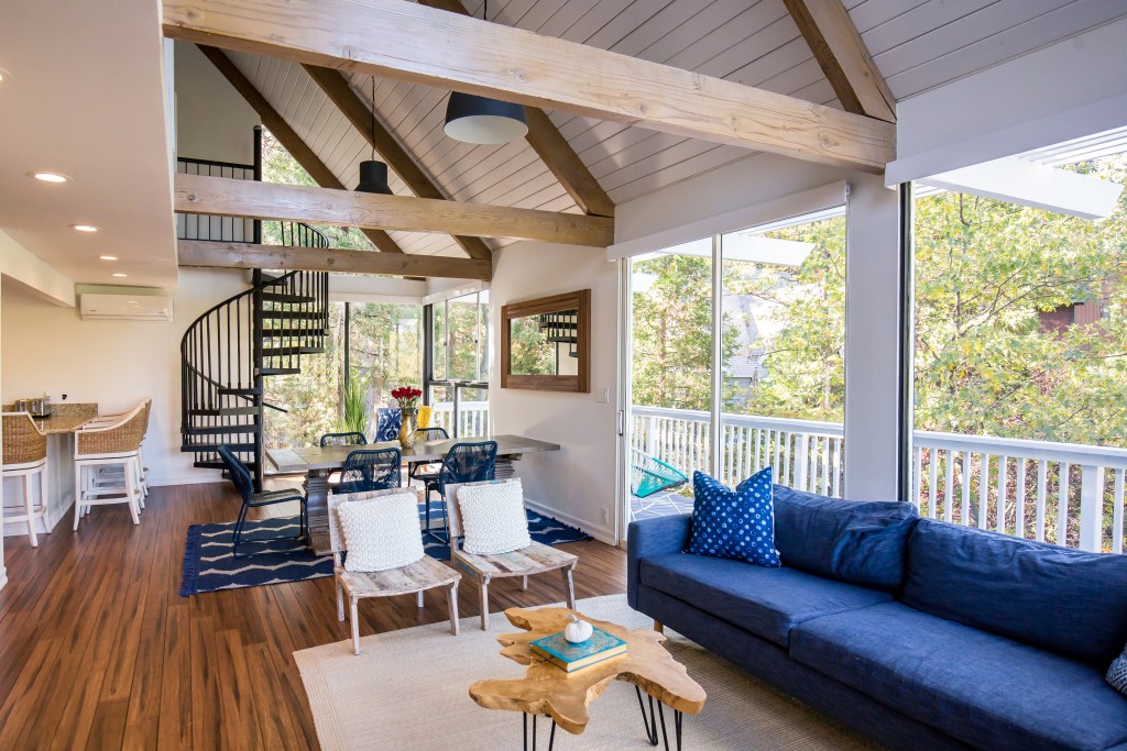 Modern farmhouse living room with a blue sofa