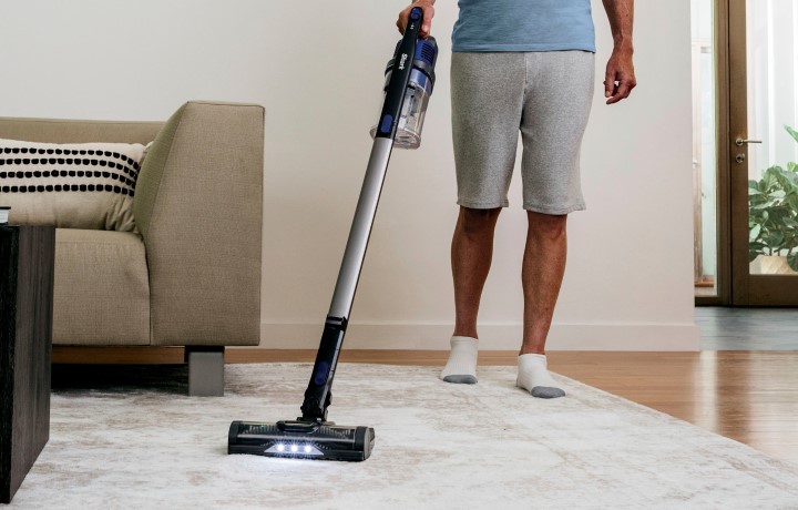 Man using Shark cordless vacuum