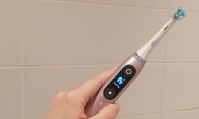 amazon oral b electric toothbrush deal prime day 2022 held in hand