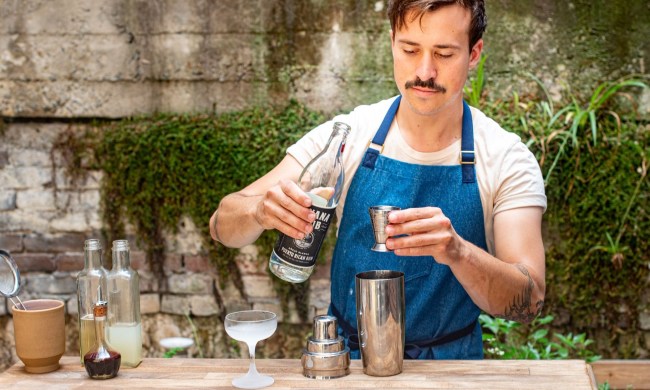 Helt Studio apron worn by bartender making drinks