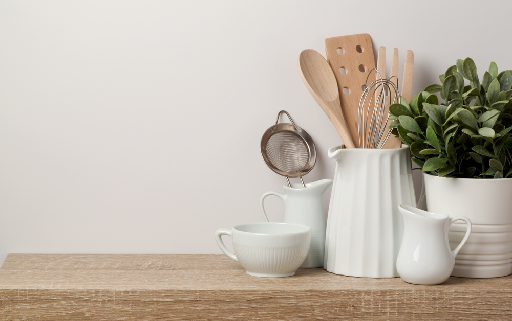 Containers of utensils on a kitchen counter