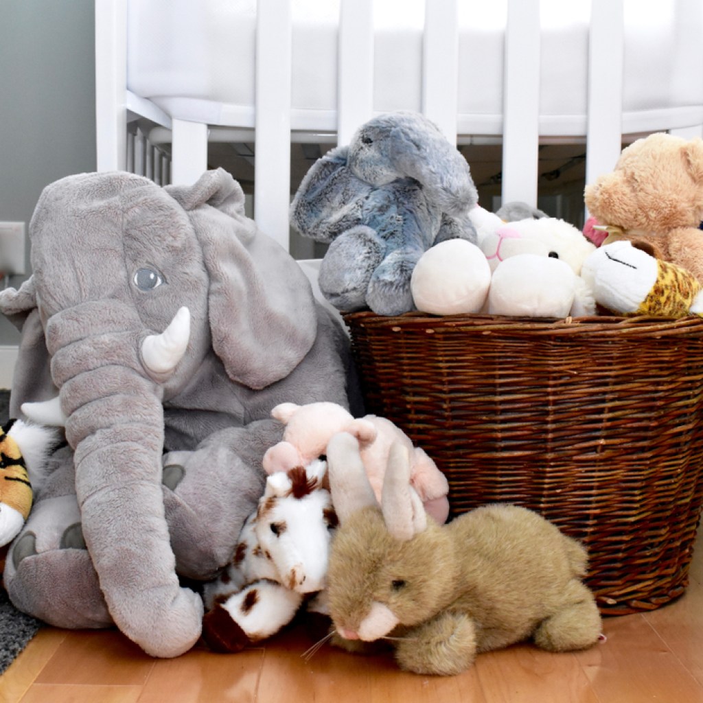 Toddler bedroom with baske of stuffed toys