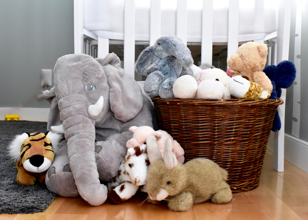 Toddler bedroom with baske of stuffed toys