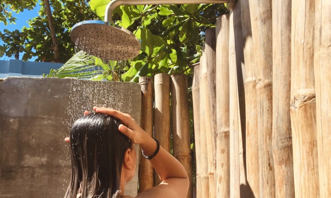Person showering in an outdoor shower