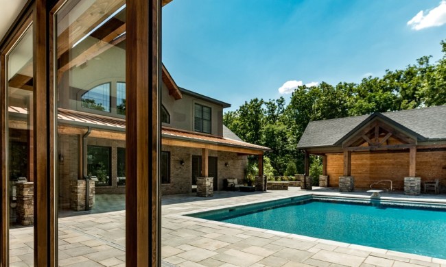 Backyard pool with pool house on the side