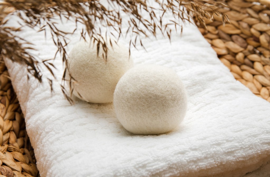 wool dryer balls on a white cloth surface