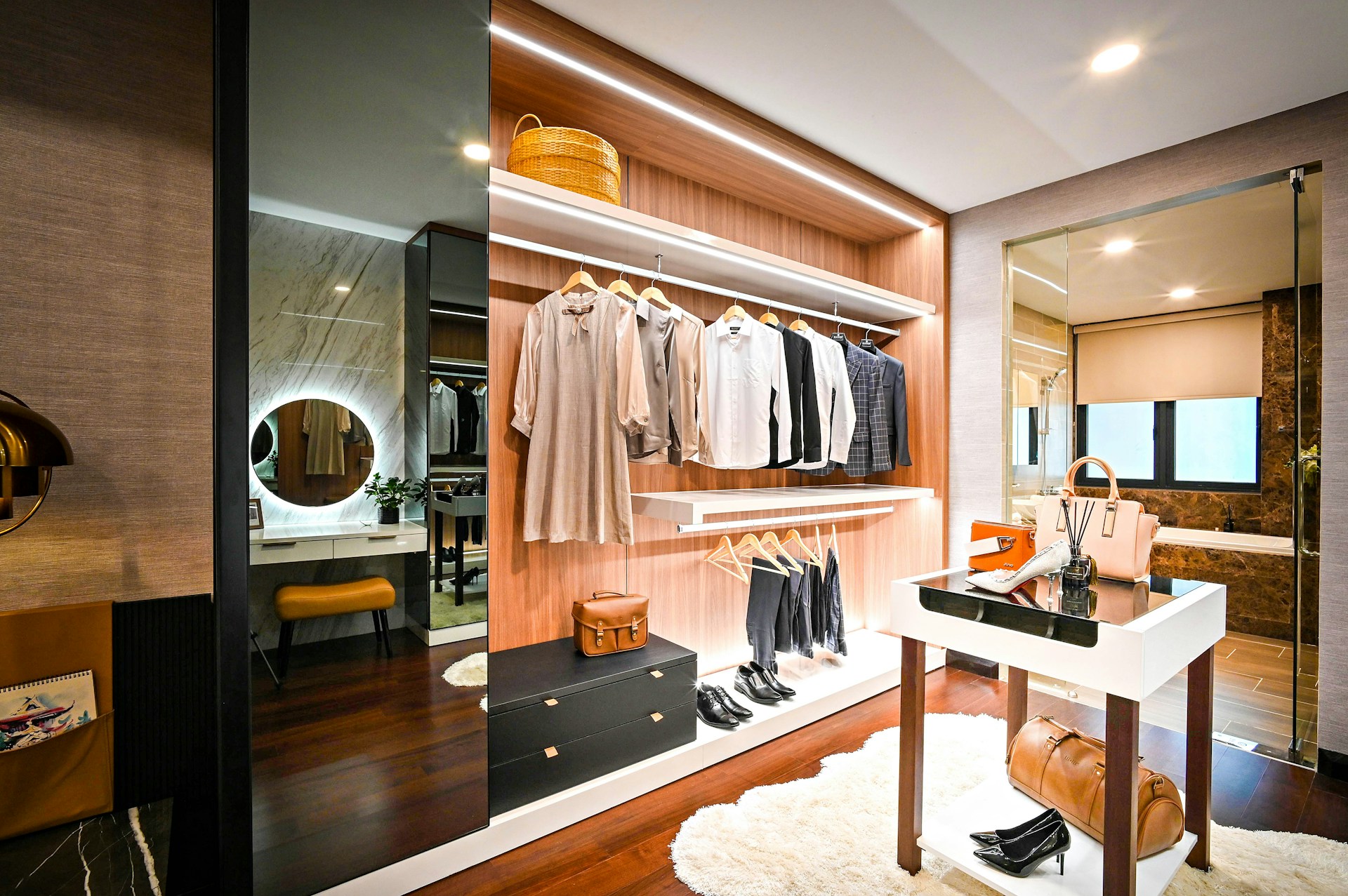 modern walk in closet with furniture