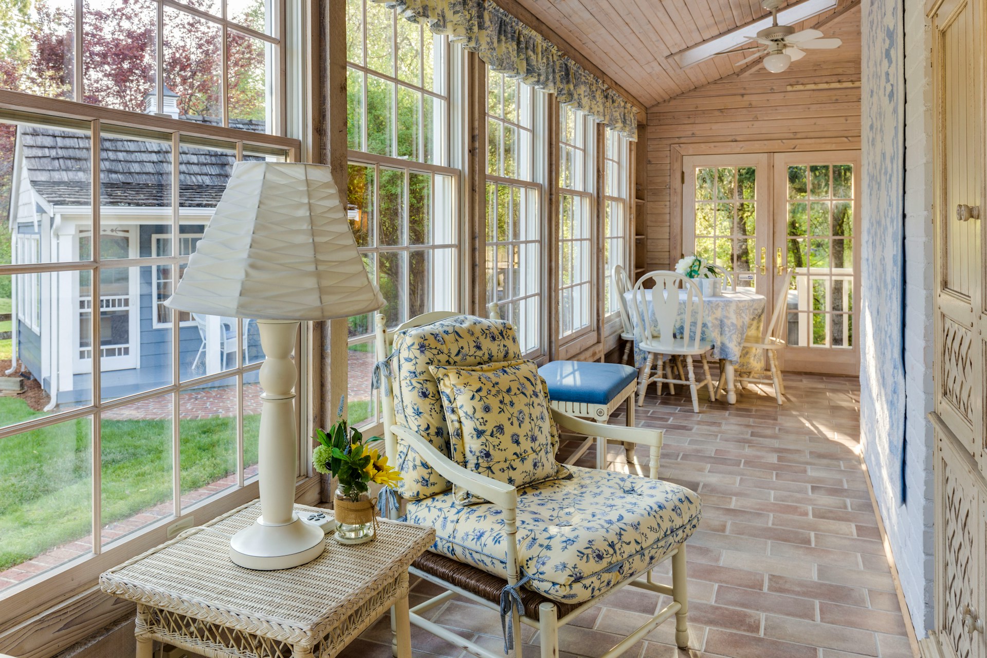 English cottage style sunroom with brick flooring