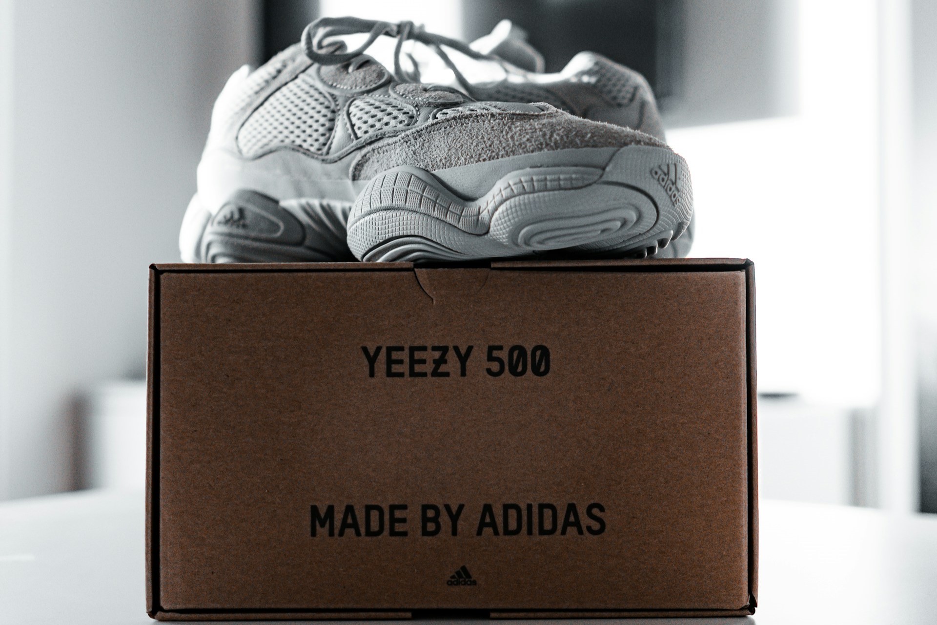 Nike shoes on brown shoe box with label on the side