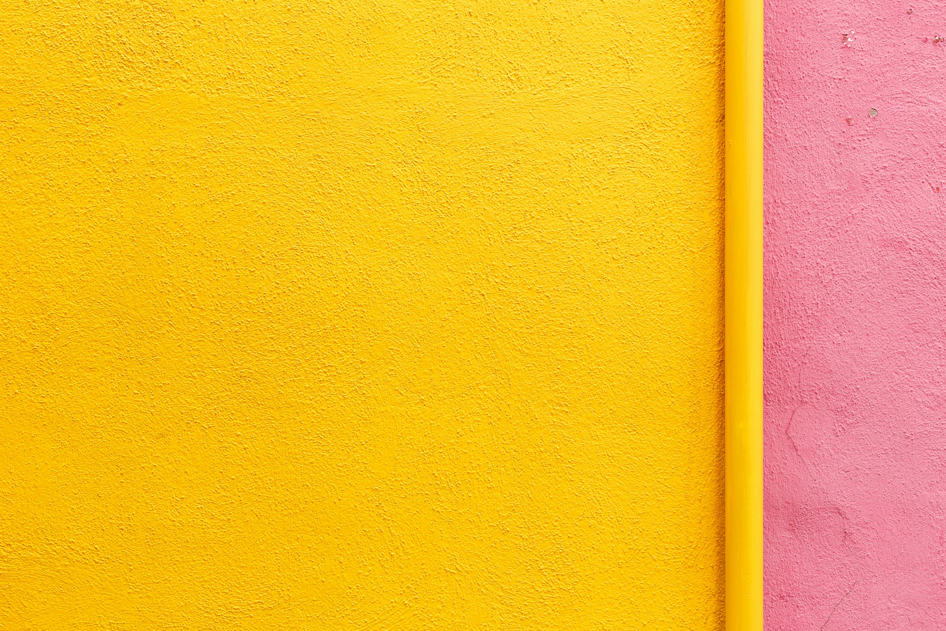 Bright yellow and pink painted wall