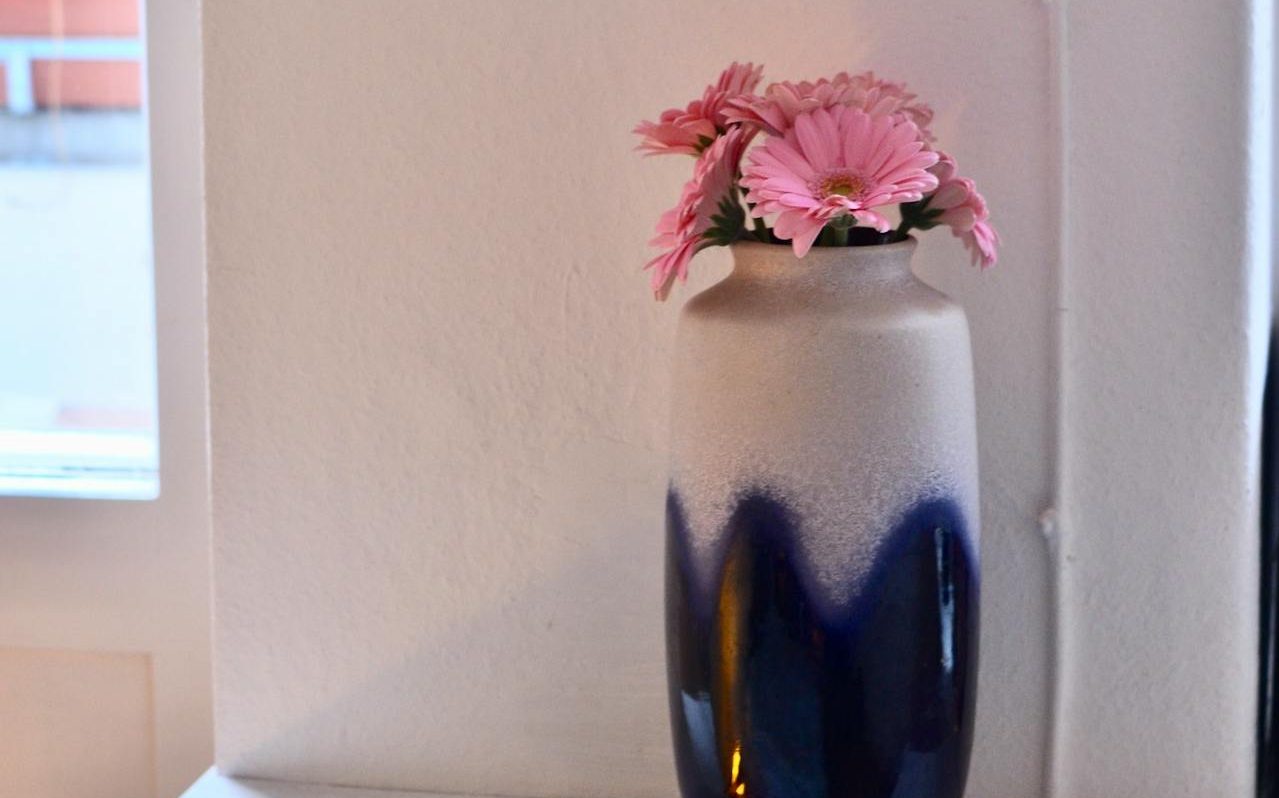 Navy and white vase with pink flowers