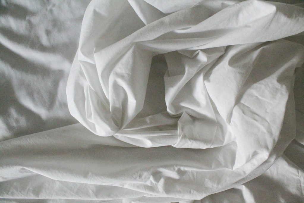Crumpled white sheets