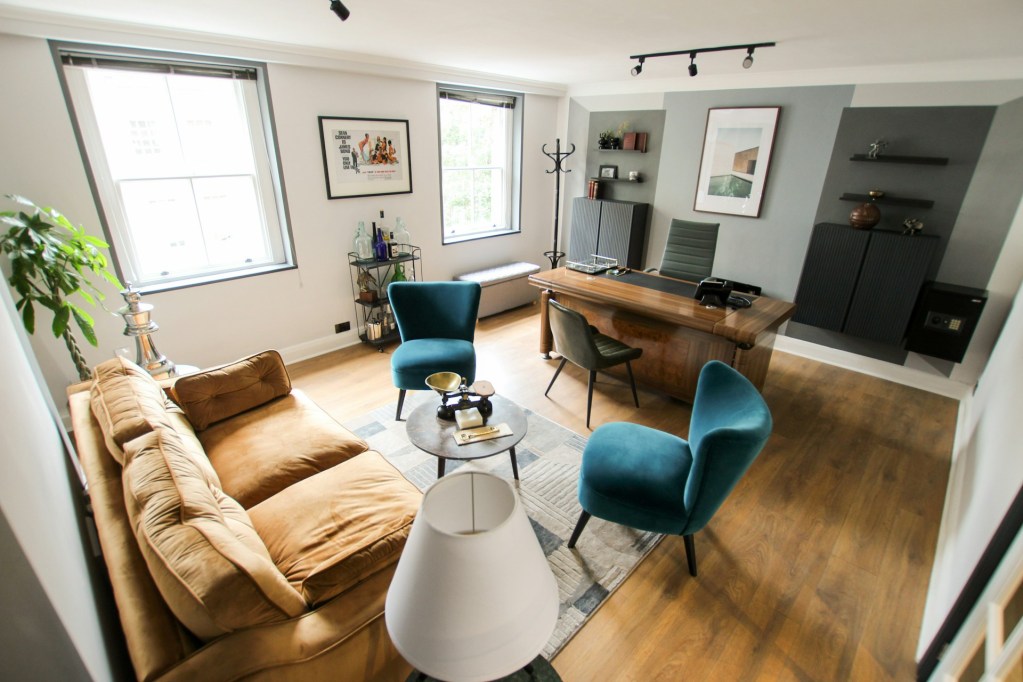 Classic home office with green accent chairs