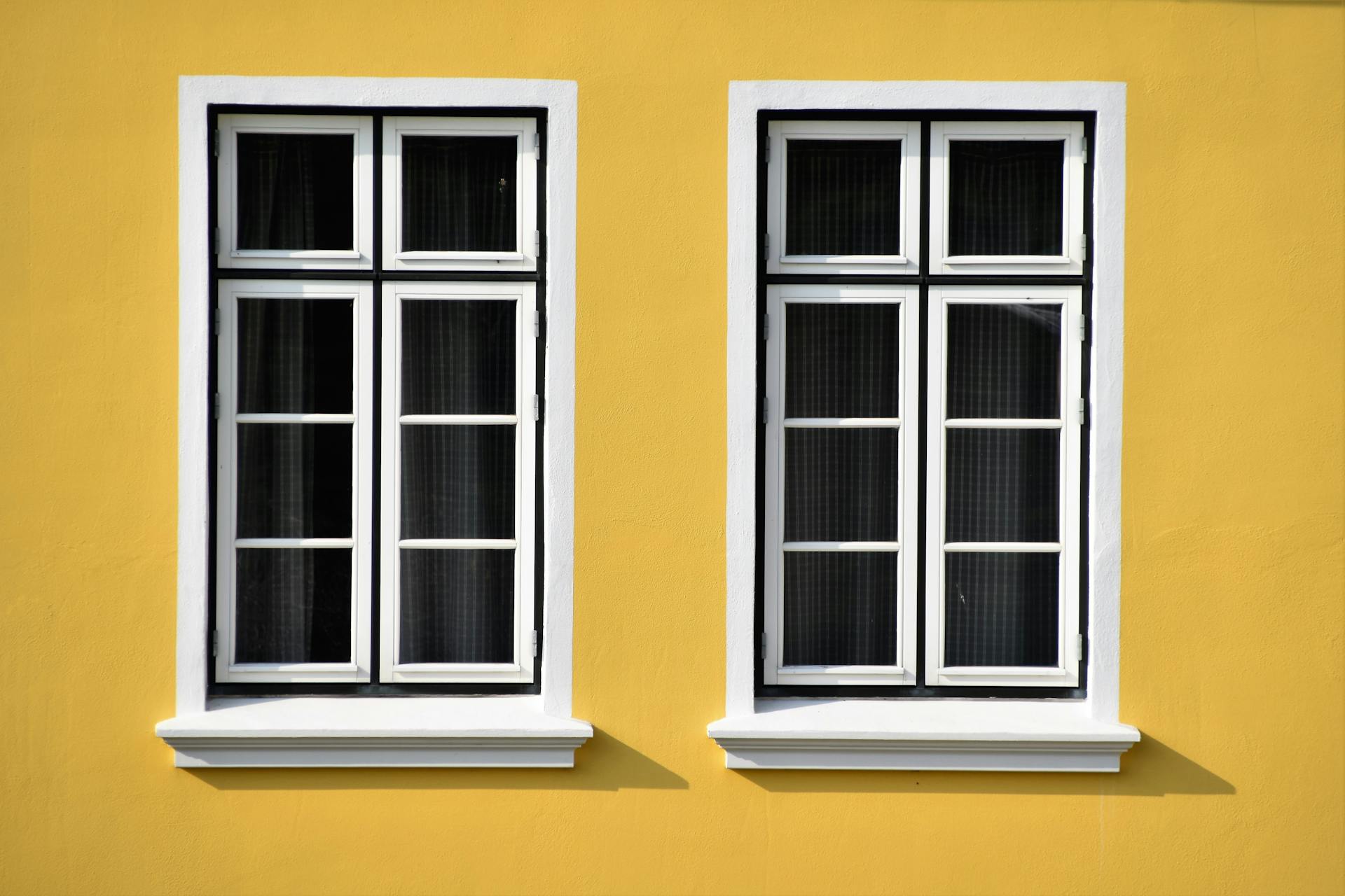Closed white wooden-framed glass windows