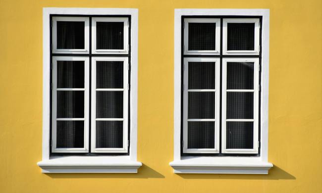 Closed white wooden-framed glass windows