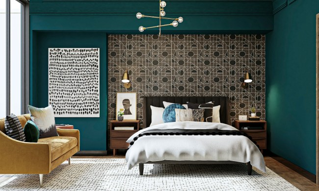 bedroom with green walls and a patterned accent wall