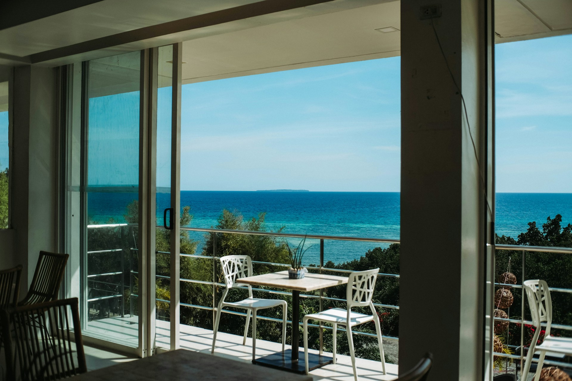 Balcony sliding glass door with tucked away vertical blinds