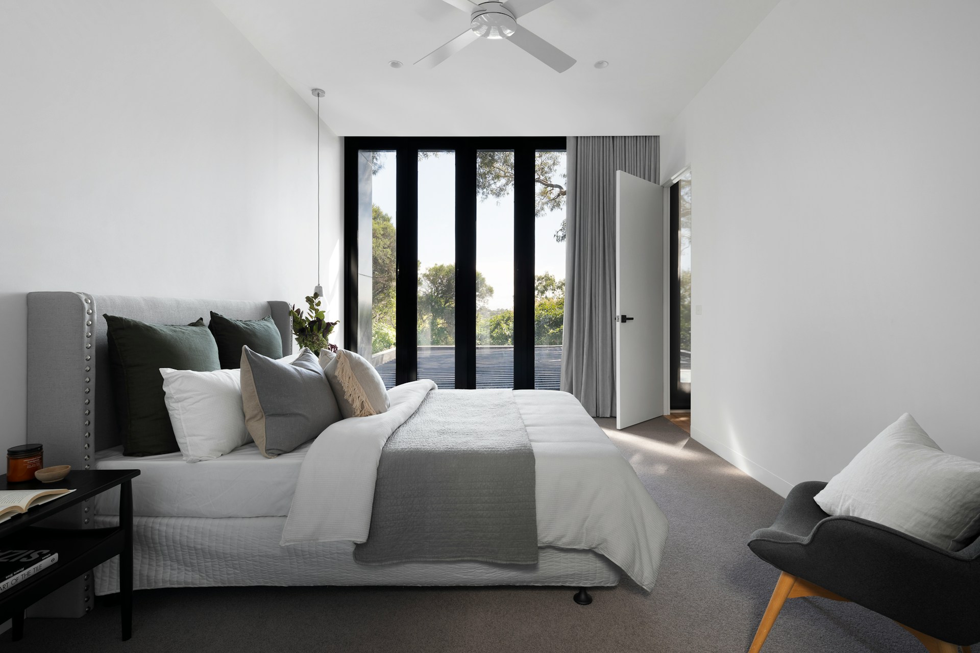 Sliding glass doors with thick curtains in bedroom.